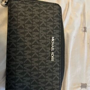Black Michael Kors wristlet/wallet. Jet set style.